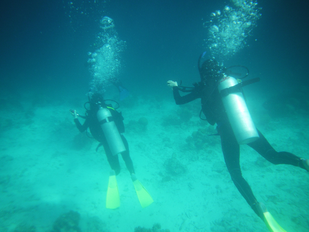 Divers off the shore of Semporna, Borneo.