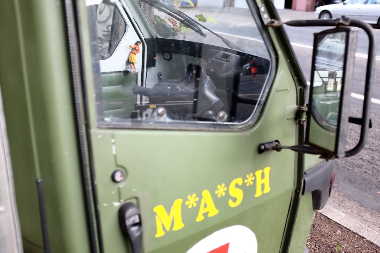 240/365: Came past this little M*A*S*H car with a hula-figure in it.